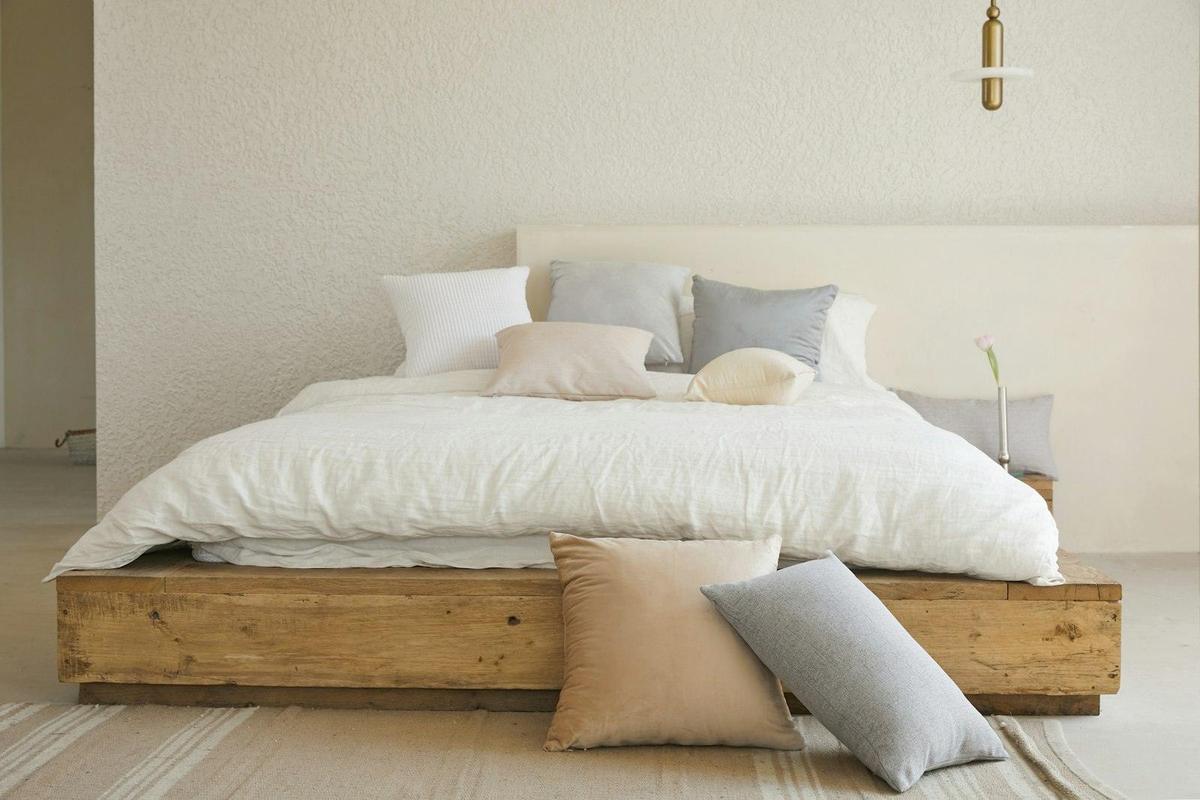 Made bed with layered linen bedding