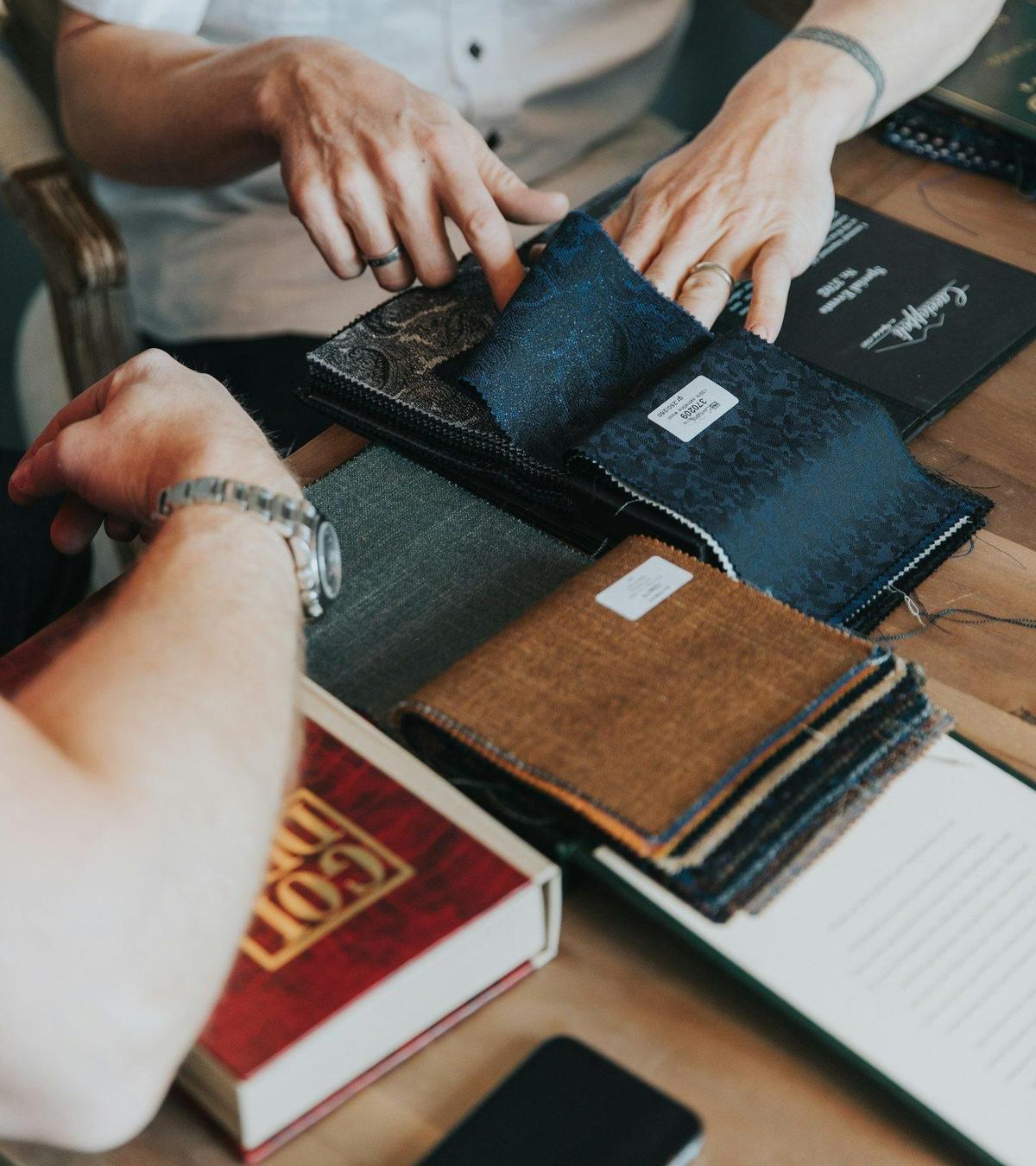 Choosing fabric from sample books