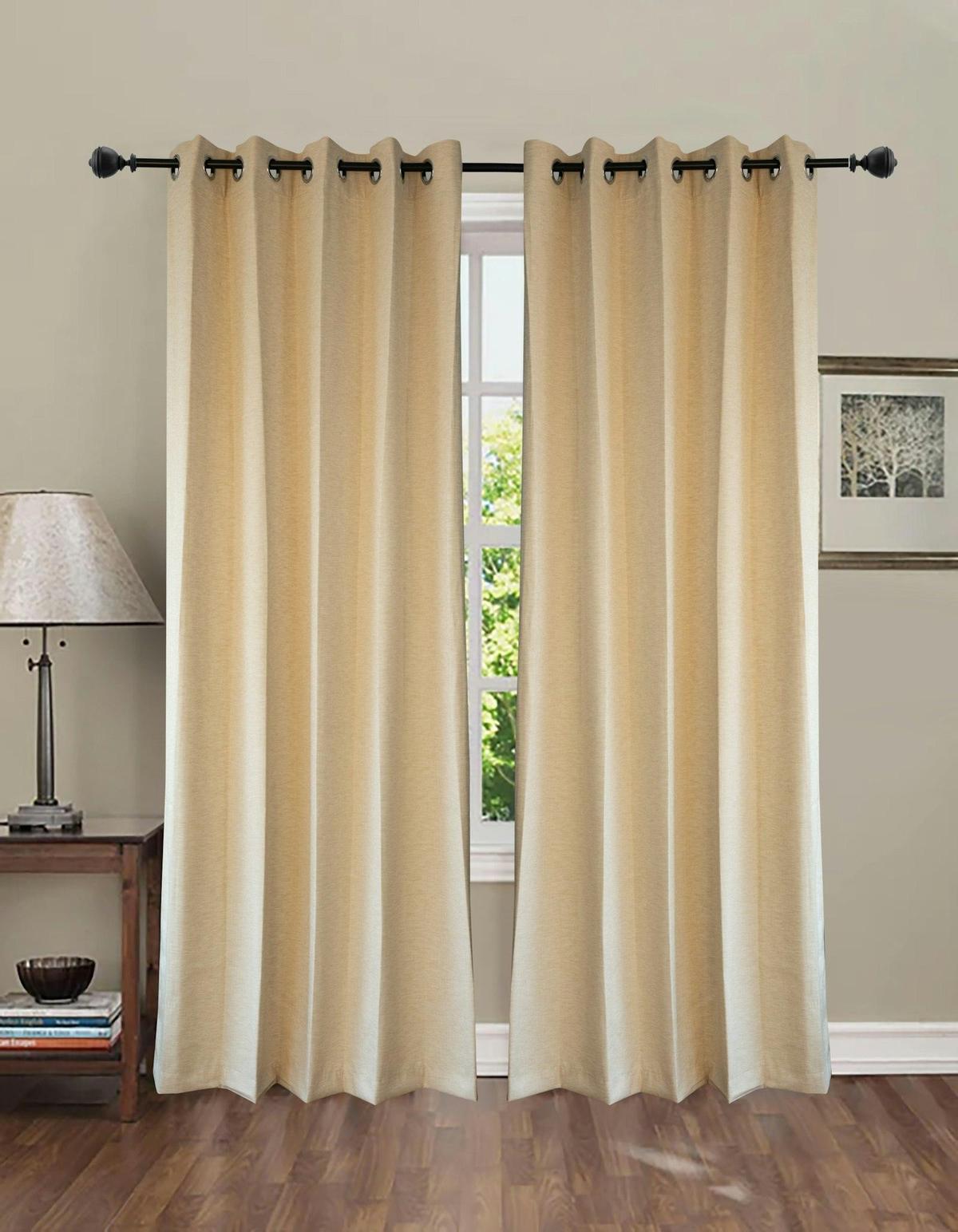 Floor-length cream drapery panels