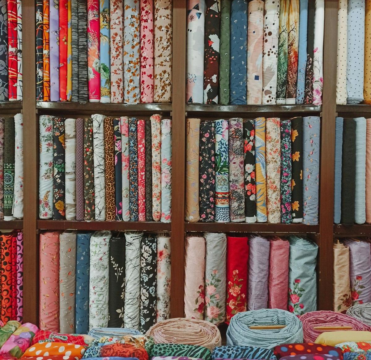 Shelves of fabric bolts floor to ceiling