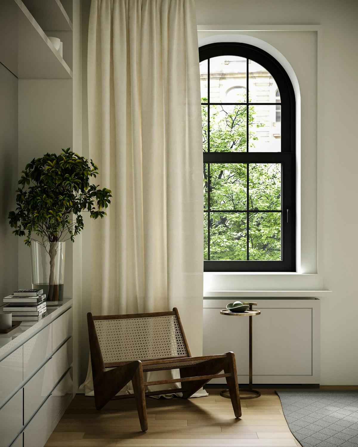 Floor-length cream drapery beside an arched window