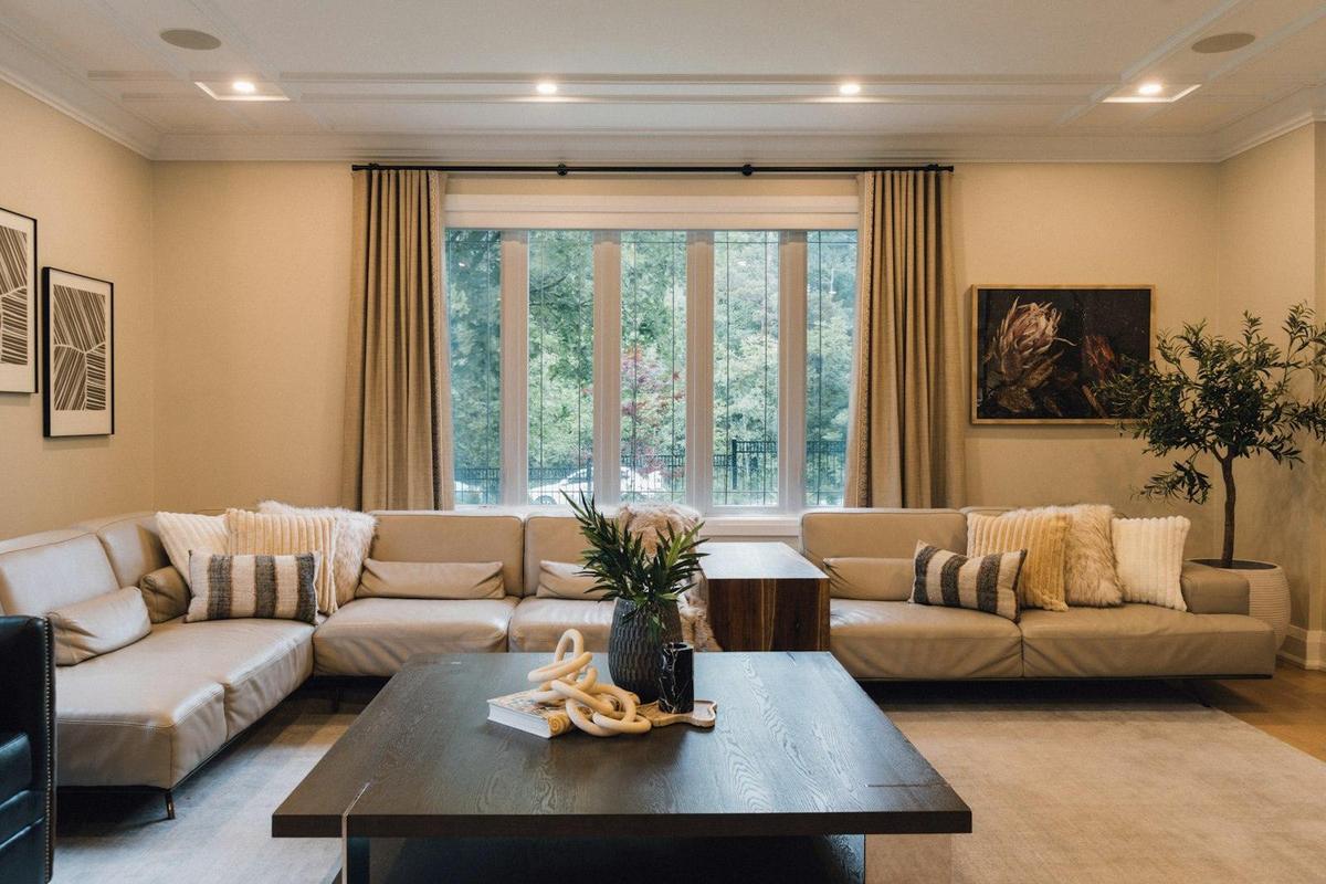 Sunlit living room with shades on every window