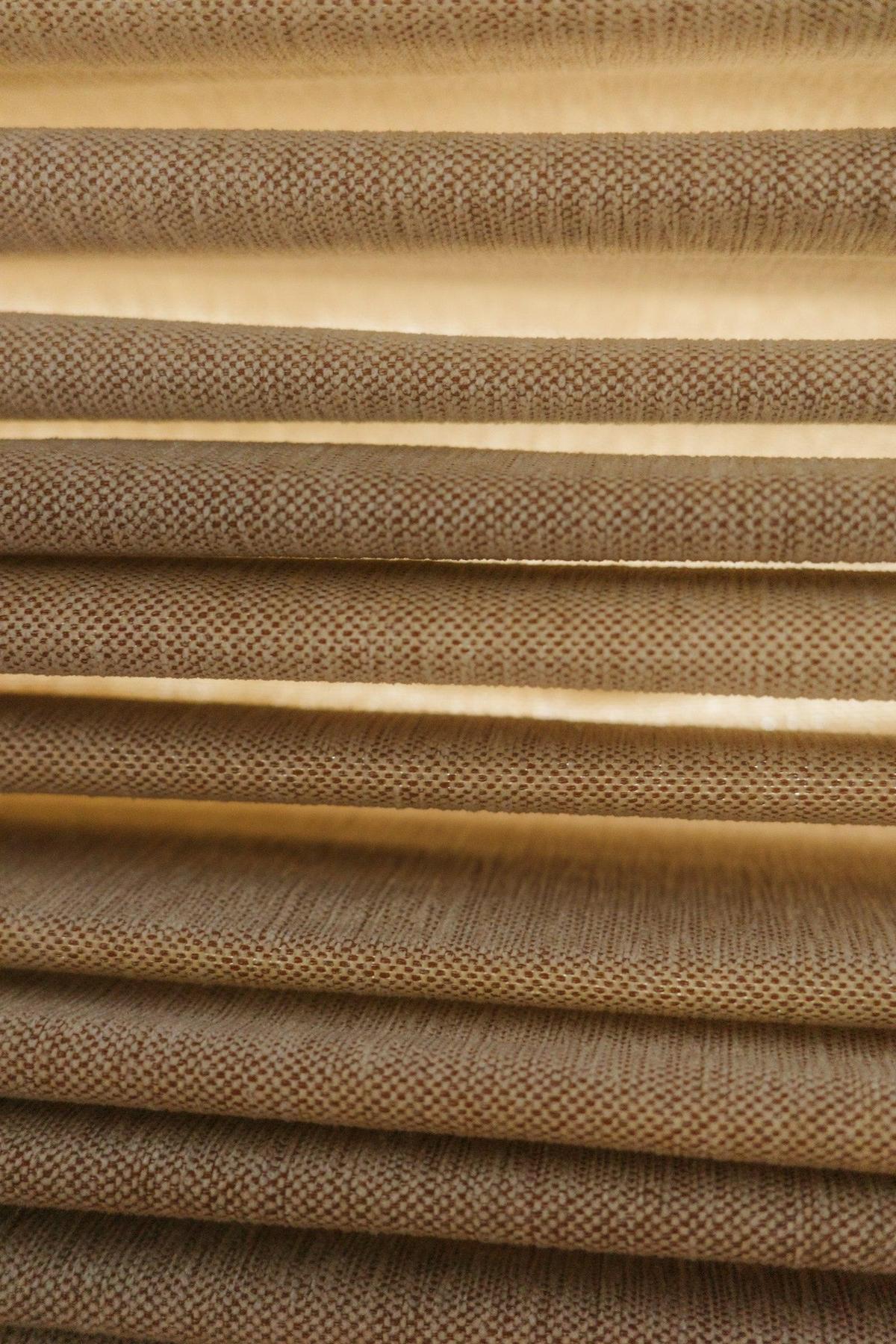 Close view of a woven fabric window shade