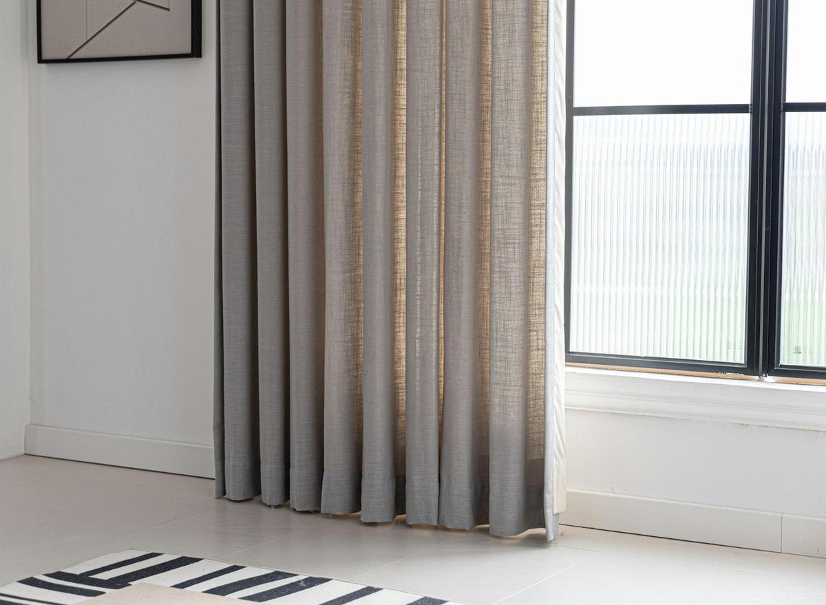 Light-filtering shade on a tall window